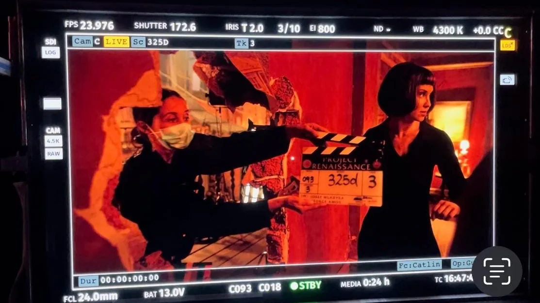 Natalie Walsh on the monitor, on set